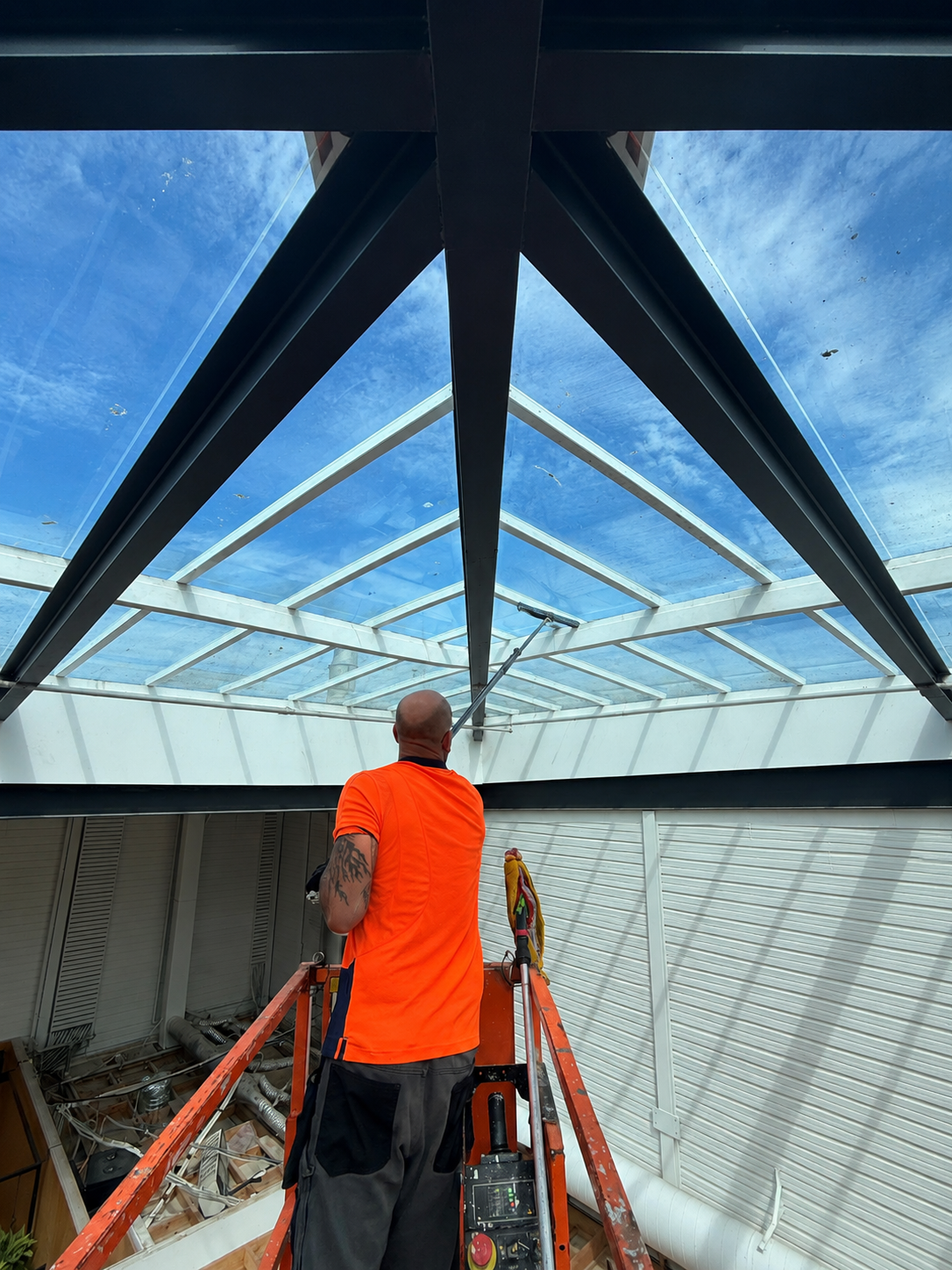 Technicians completing ceiling access work